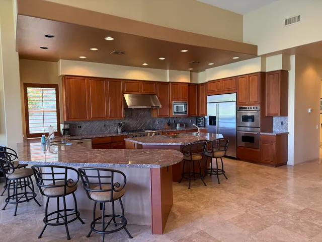 a view of kitchen and a fireplace