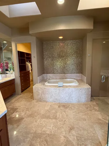 a bedroom with a bed and a book shelf