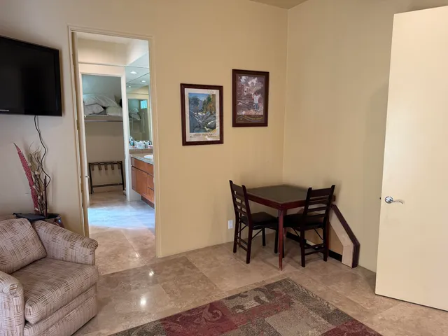 a view of a swimming pool and lounge chairs