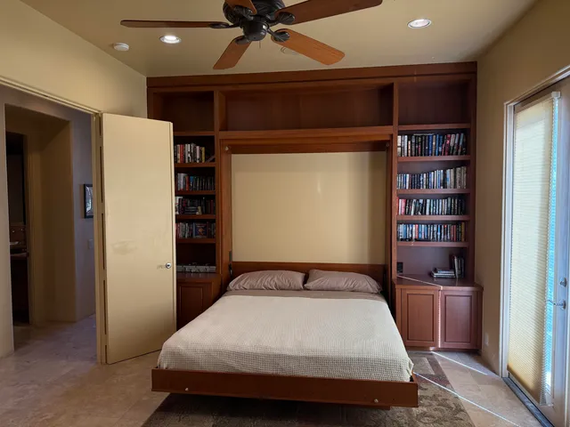 a view of a chairs and table in the patio