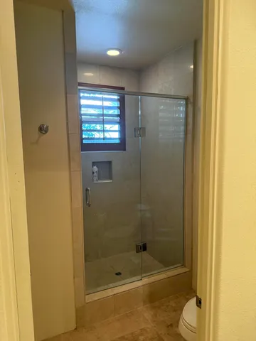 a swimming pool with outdoor seating and yard