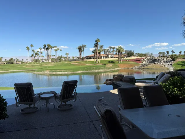 a bedroom with a bed and a chair