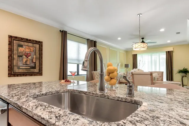 a view of kitchen island a sink and living room