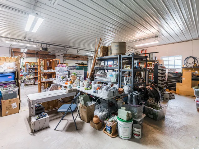 a view of a dining room with furniture and a chandelier
