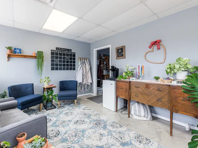 a view of a dining room with furniture and window