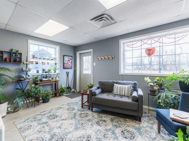 a white toilet sitting next to a white sink