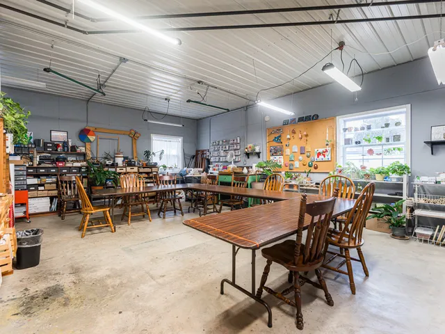 an aerial view of a residential apartment building with a yard