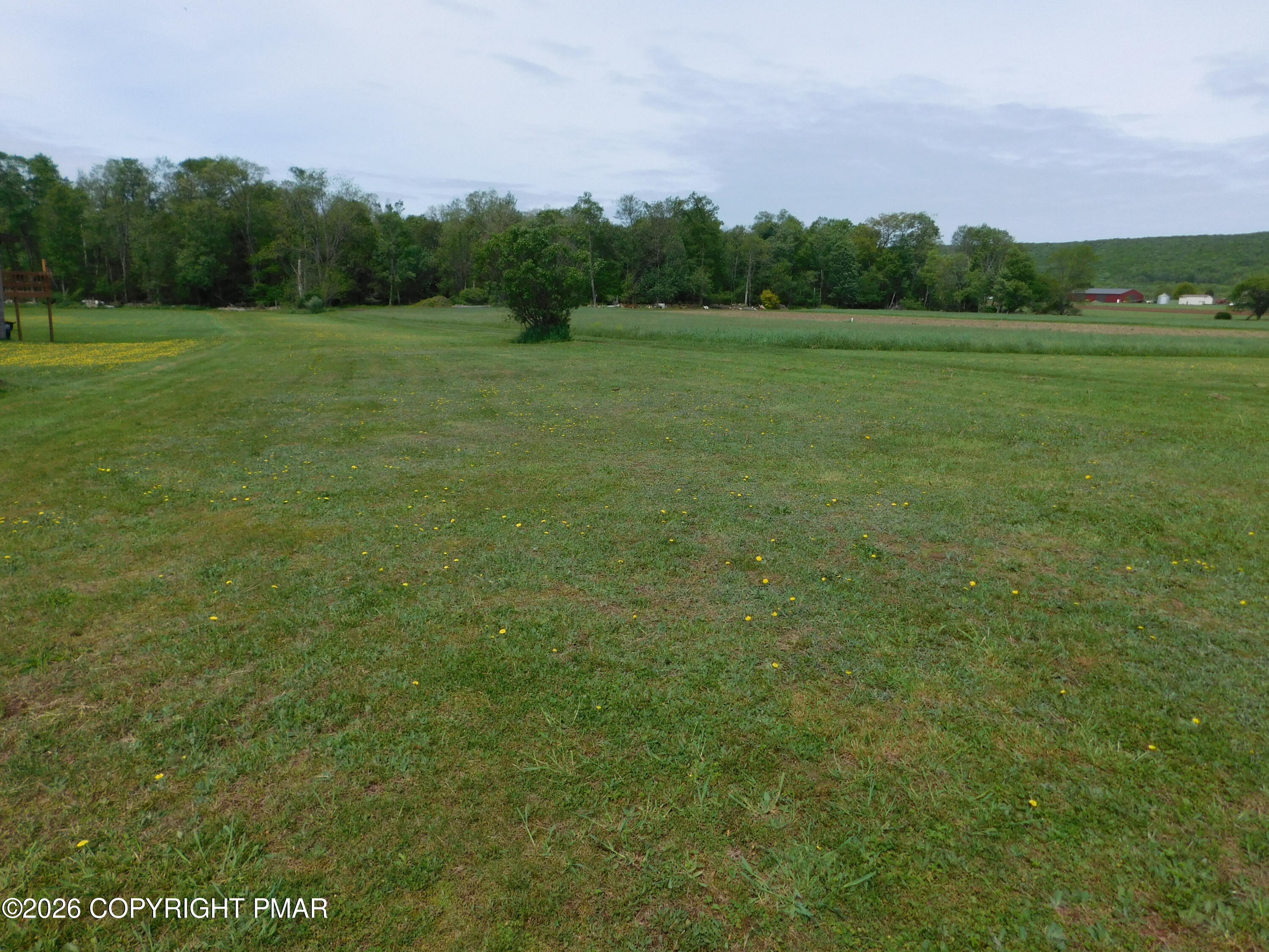 3551 Quakake Road Weatherly, PA 18255 - Photo 2 of 8 a view of field with trees in the background