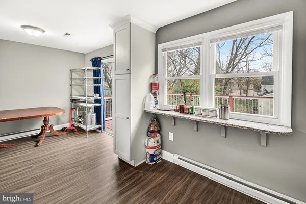 a room with wooden floor and a window