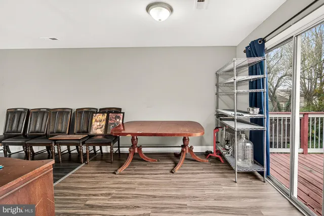 a reading room with furniture and a book shelf