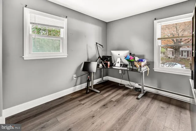 a view of a room with gym equipment and a window