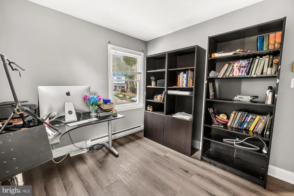 a room with furniture cabinets and book shelf