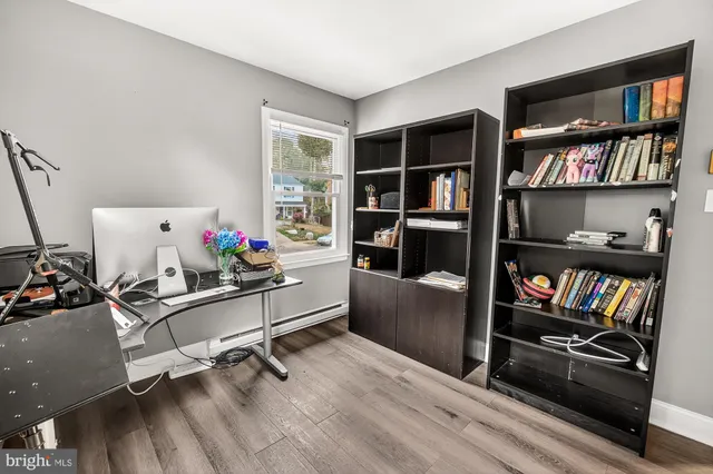 a room with furniture cabinets and book shelf