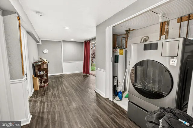 a view of a hallway with washer and dryer
