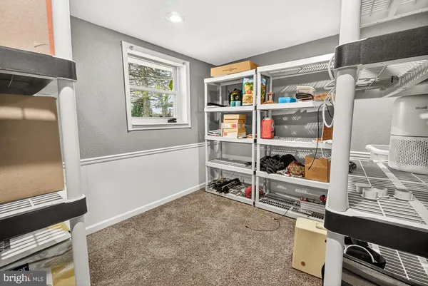 a view of room with window and shelf