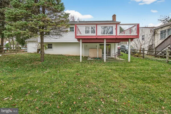 a house that has a tree in front of it