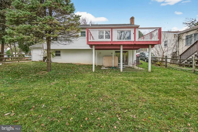 a house that has a tree in front of it