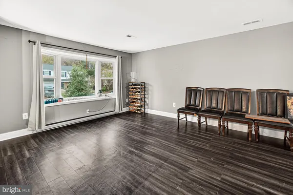 a view of livingroom with furniture wooden floor and window