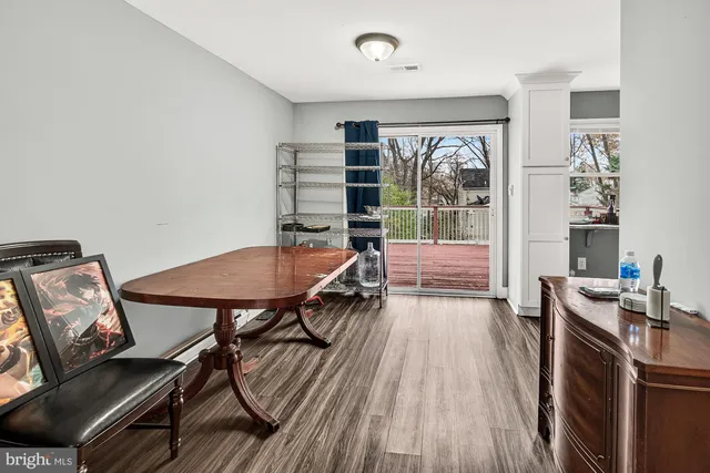 a workspace with furniture window and wooden floor