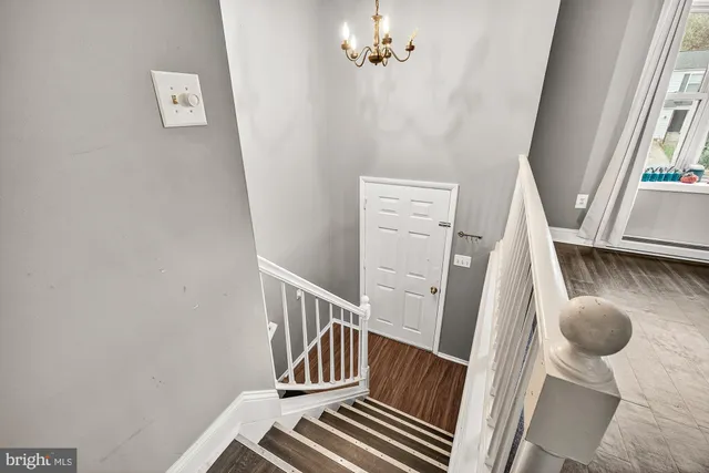 a view of entryway with wooden floor