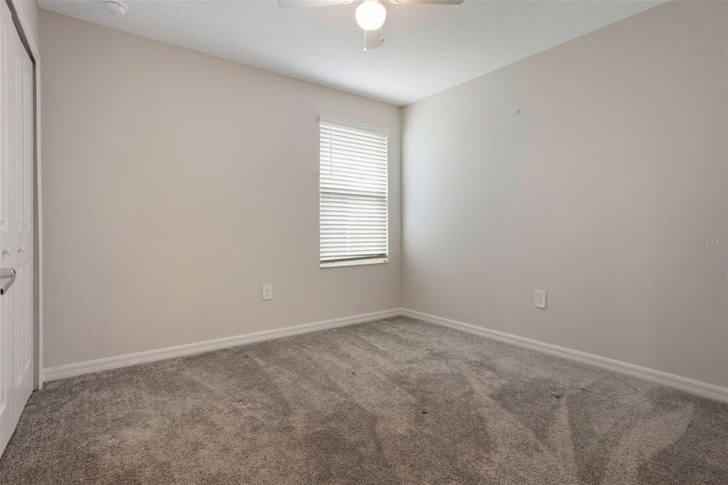 2932 Muller Oak Loop Ocoee, FL 34761 - Photo 20 of 32 an empty room with windows and closet