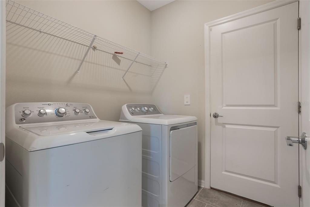 2932 Muller Oak Loop Ocoee, FL 34761 - Photo 28 of 32 a utility room with dryer and washer