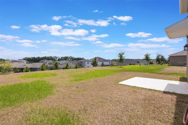 a house view with a backyard space