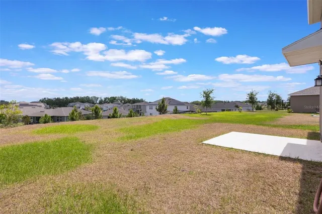 a house view with a backyard space