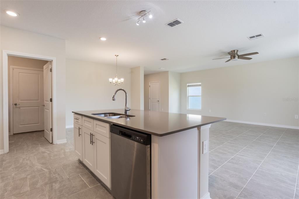 2932 Muller Oak Loop Ocoee, FL 34761 - Photo 10 of 32 a kitchen with a sink and stove