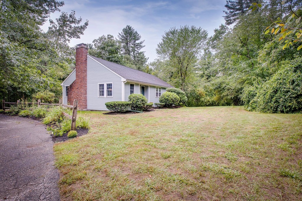 137 Depot Road Boxford, MA 01921 - Photo 1 of 18 a view of a house with a yard and potted plants