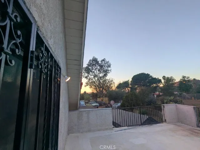 a view of walk in closet with clothes