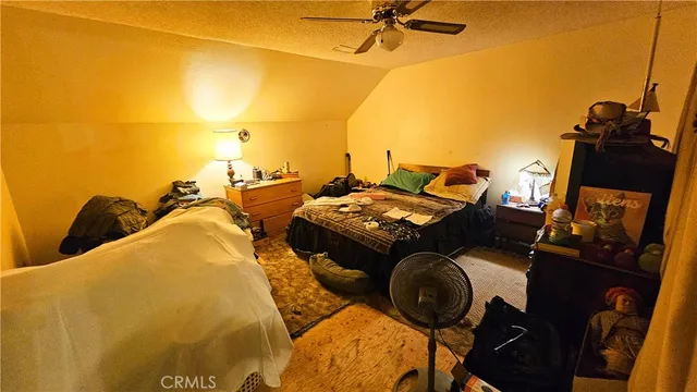 a view of walk in closet with clothes