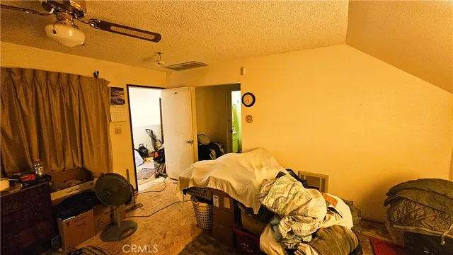 a backyard of a house with lots of green space and fountain