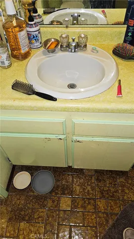 a view of a patio with table and chairs and potted plants