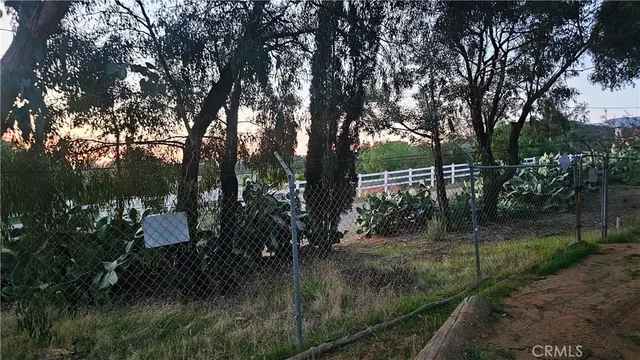 a bedroom with bed and a chandelier