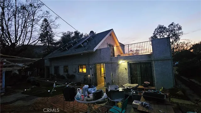 a bedroom with furniture and a wooden floor