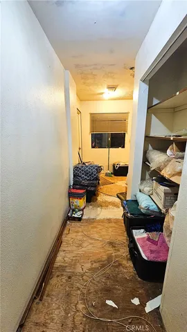 a bedroom with a bed and a chair