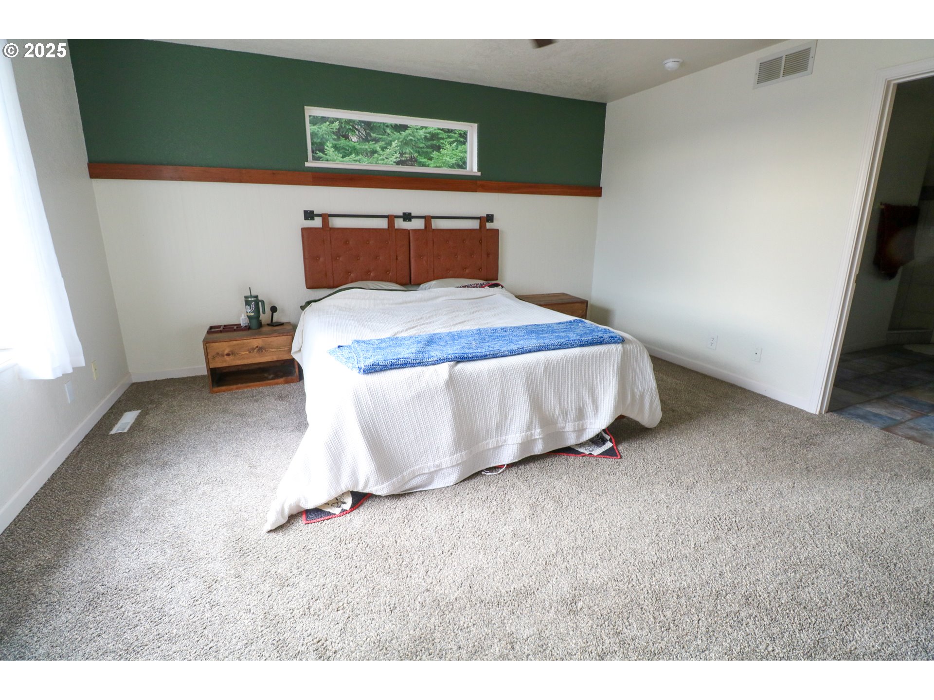 94088 Kirkendall Lane North Bend, OR 97459 - Photo 23 of 46 a bedroom with a bed and a window