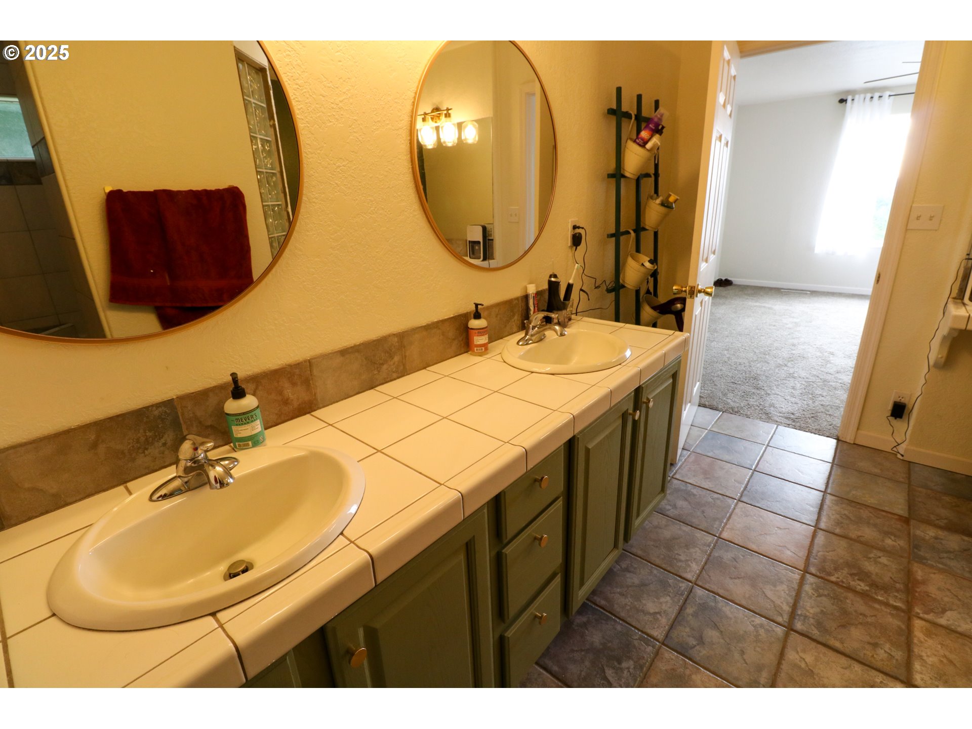 94088 Kirkendall Lane North Bend, OR 97459 - Photo 28 of 46 a bathroom with a sink and a mirror