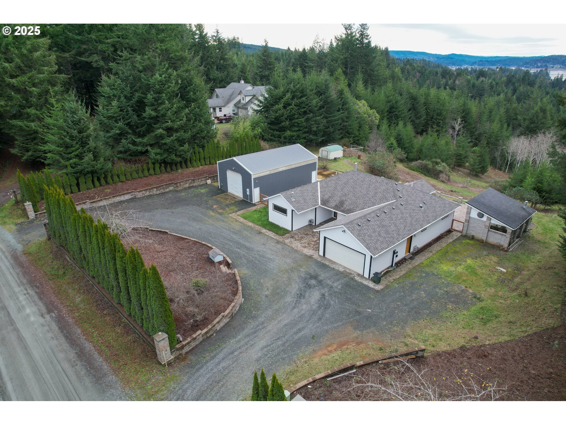 94088 Kirkendall Lane North Bend, OR 97459 - Photo 3 of 46 a view of a house with a yard