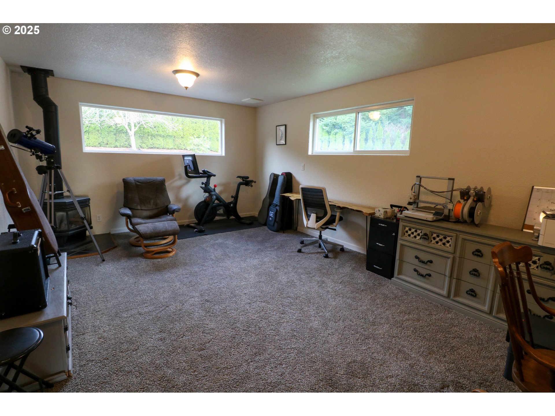 94088 Kirkendall Lane North Bend, OR 97459 - Photo 31 of 46 a view of a workspace with furniture and a window
