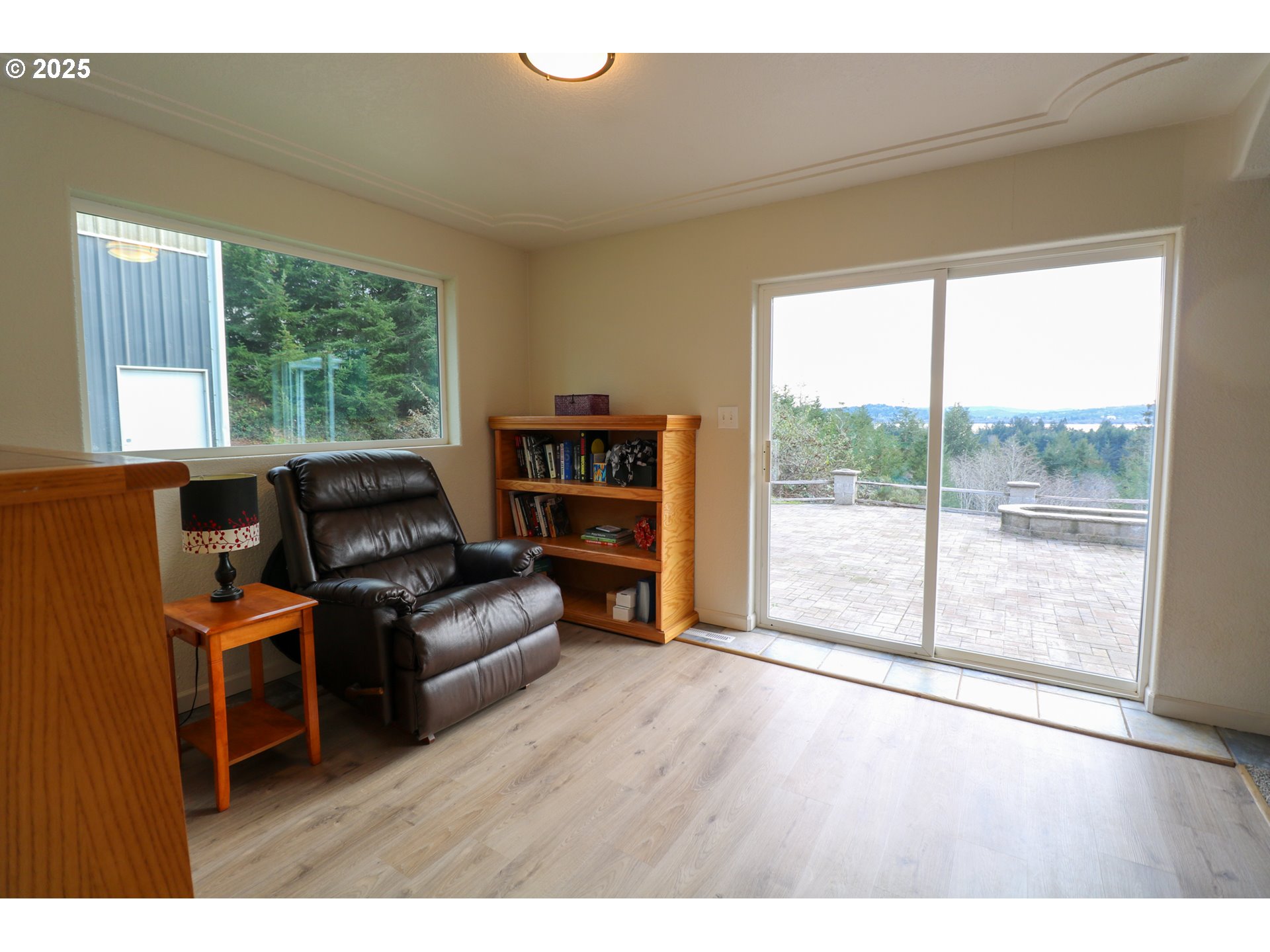 94088 Kirkendall Lane North Bend, OR 97459 - Photo 36 of 46 a living room with furniture and a large window