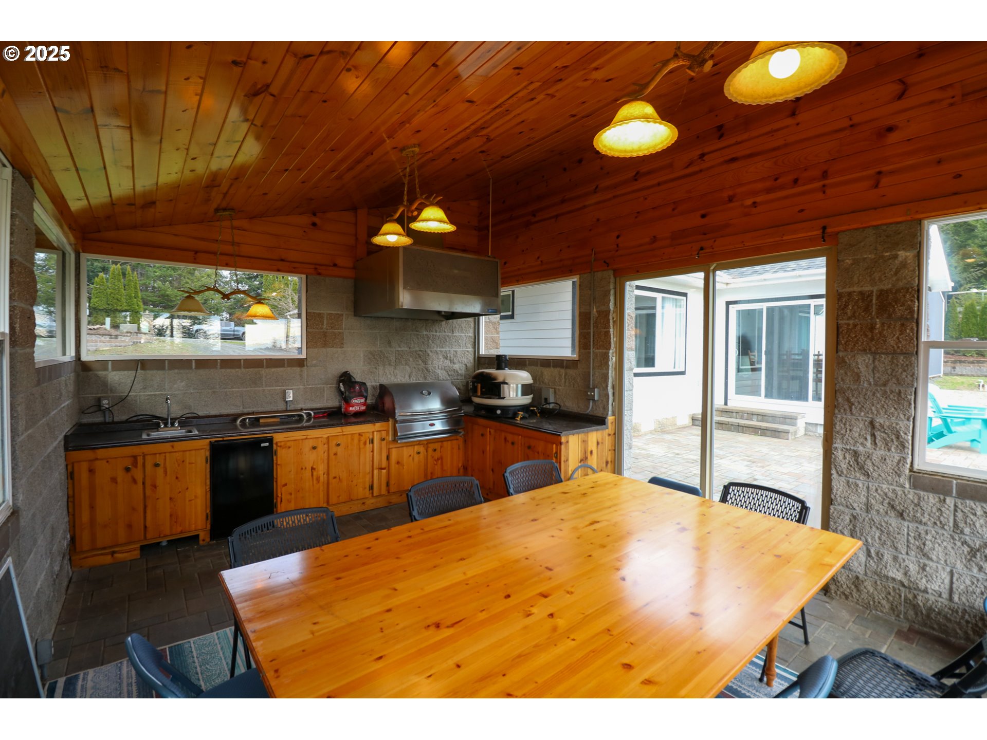 94088 Kirkendall Lane North Bend, OR 97459 - Photo 43 of 46 a kitchen with stainless steel appliances kitchen island granite countertop a stove a sink and a microwave