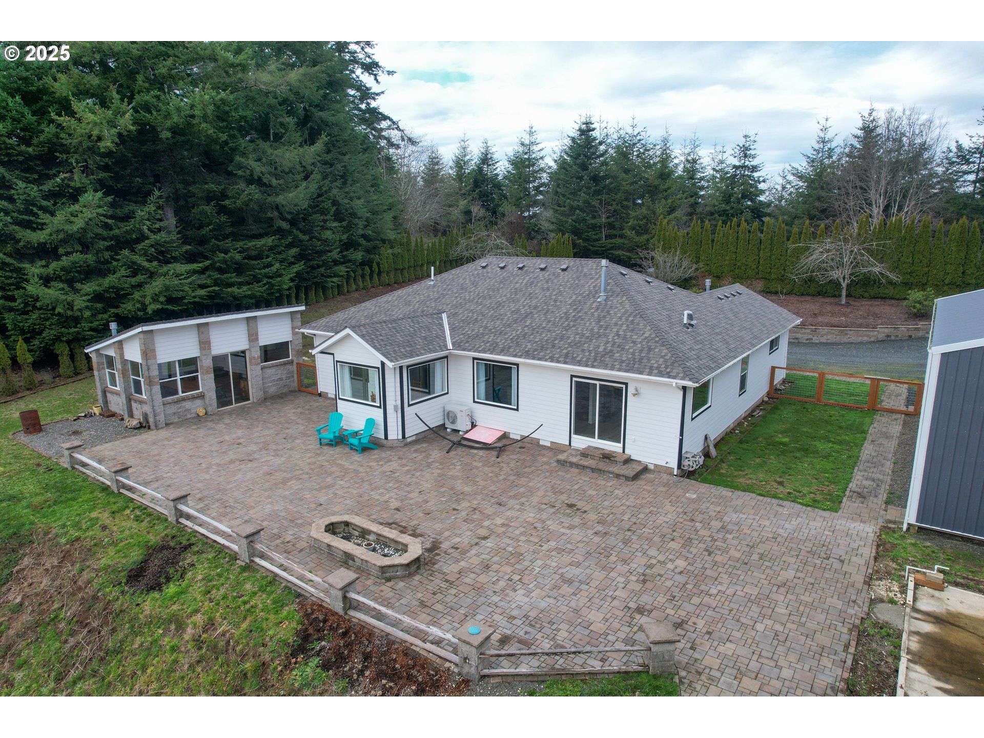 94088 Kirkendall Lane North Bend, OR 97459 - Photo 8 of 46 a aerial view of a house next to a yard