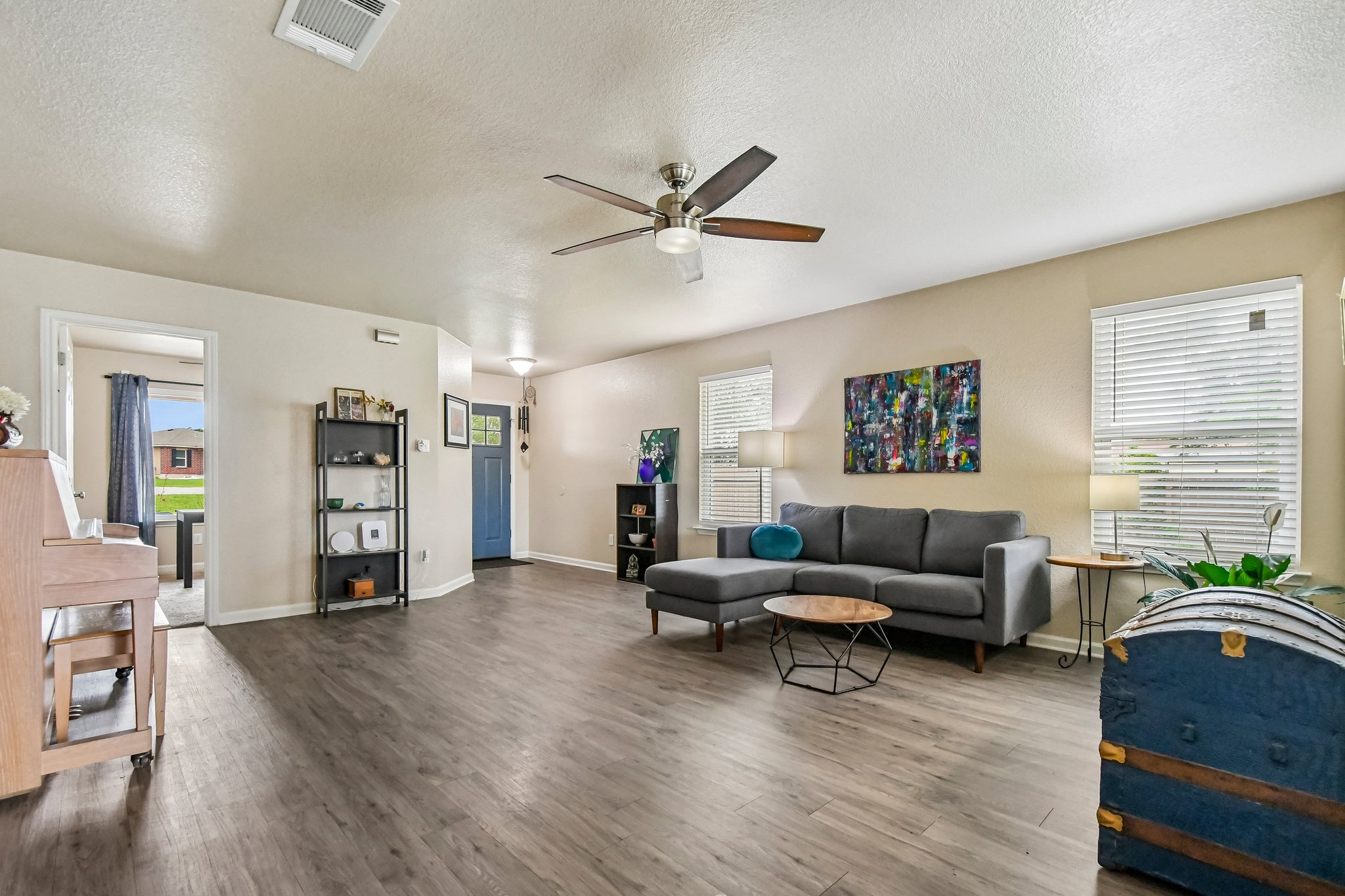 125 Mason Reed Cove Kyle, TX 78640 - Photo 7 of 39 a living room with furniture and wooden floor