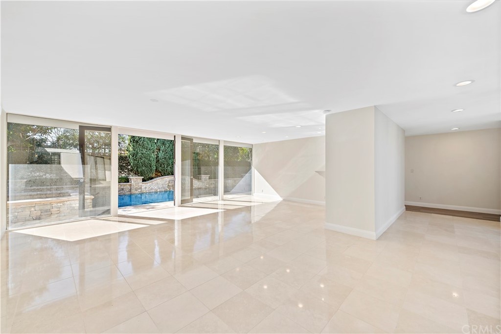 147 Monarch Bay Drive Dana Point, CA 92629 - Photo 5 of 16 an empty room with wooden floor and windows