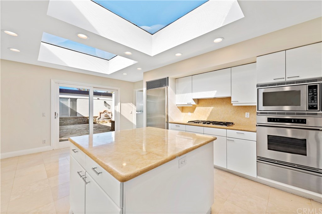 147 Monarch Bay Drive Dana Point, CA 92629 - Photo 9 of 16 a kitchen with a stove a sink and a refrigerator