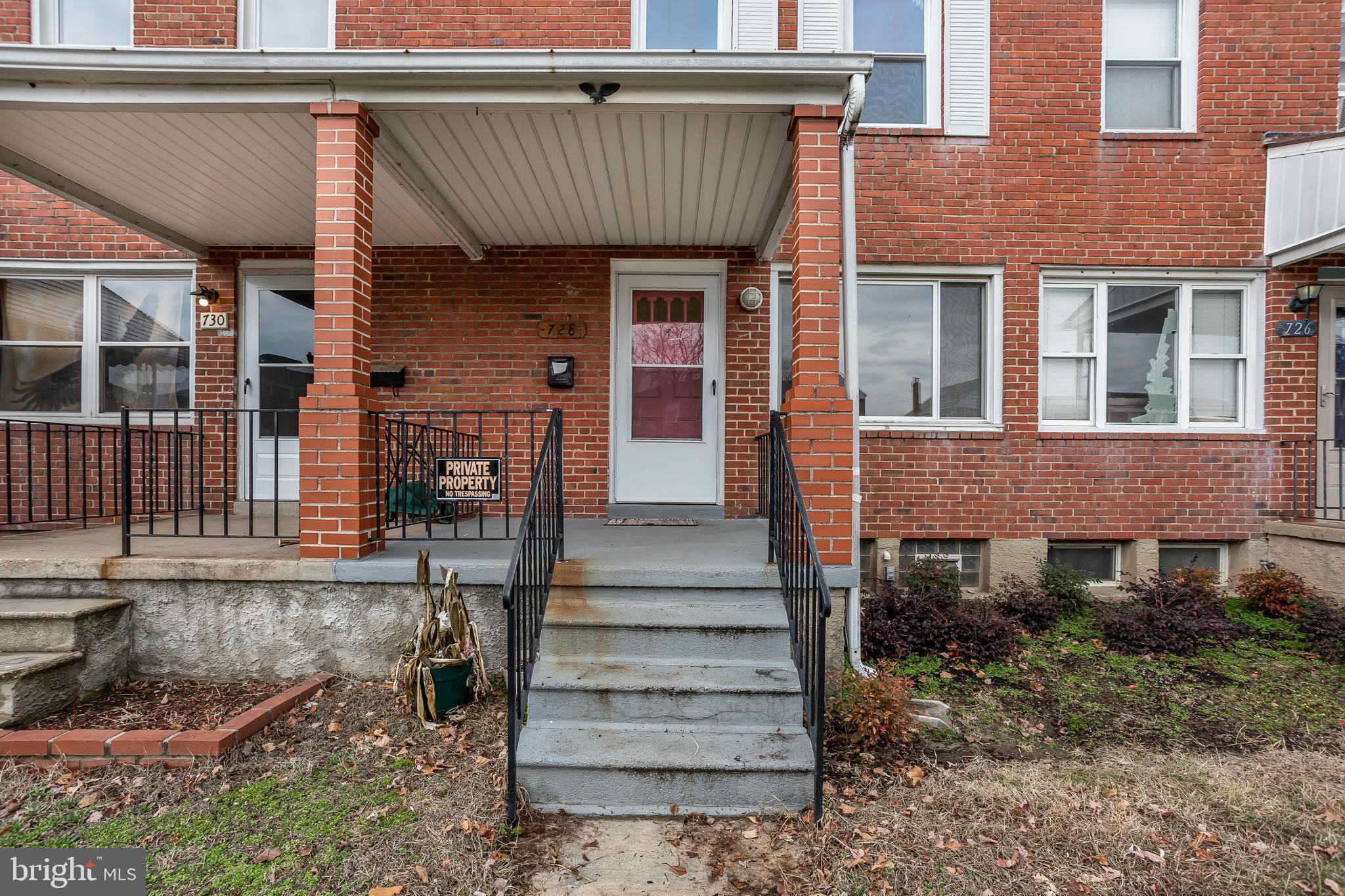 728 Aldworth Road Baltimore, MD 21222 - Photo 2 of 21 a front view of a house with stairs