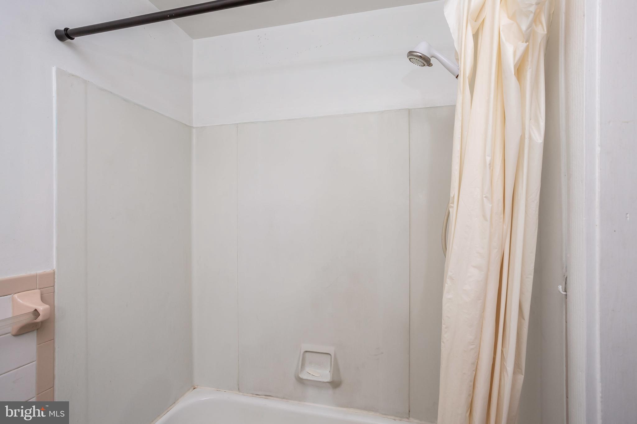 728 Aldworth Road Baltimore, MD 21222 - Photo 12 of 21 a bathroom with a shower and a toilet