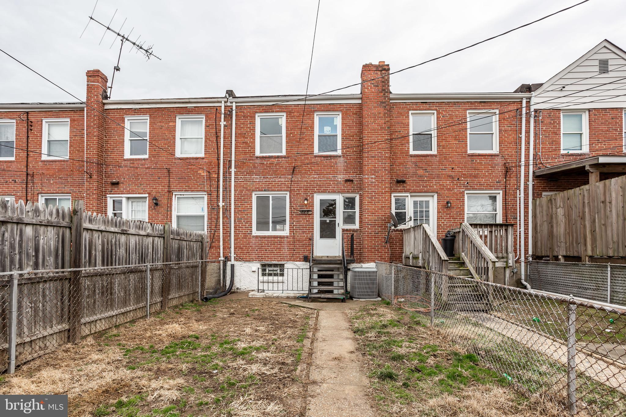728 Aldworth Road Baltimore, MD 21222 - Photo 20 of 21 a front view of a house with a yard